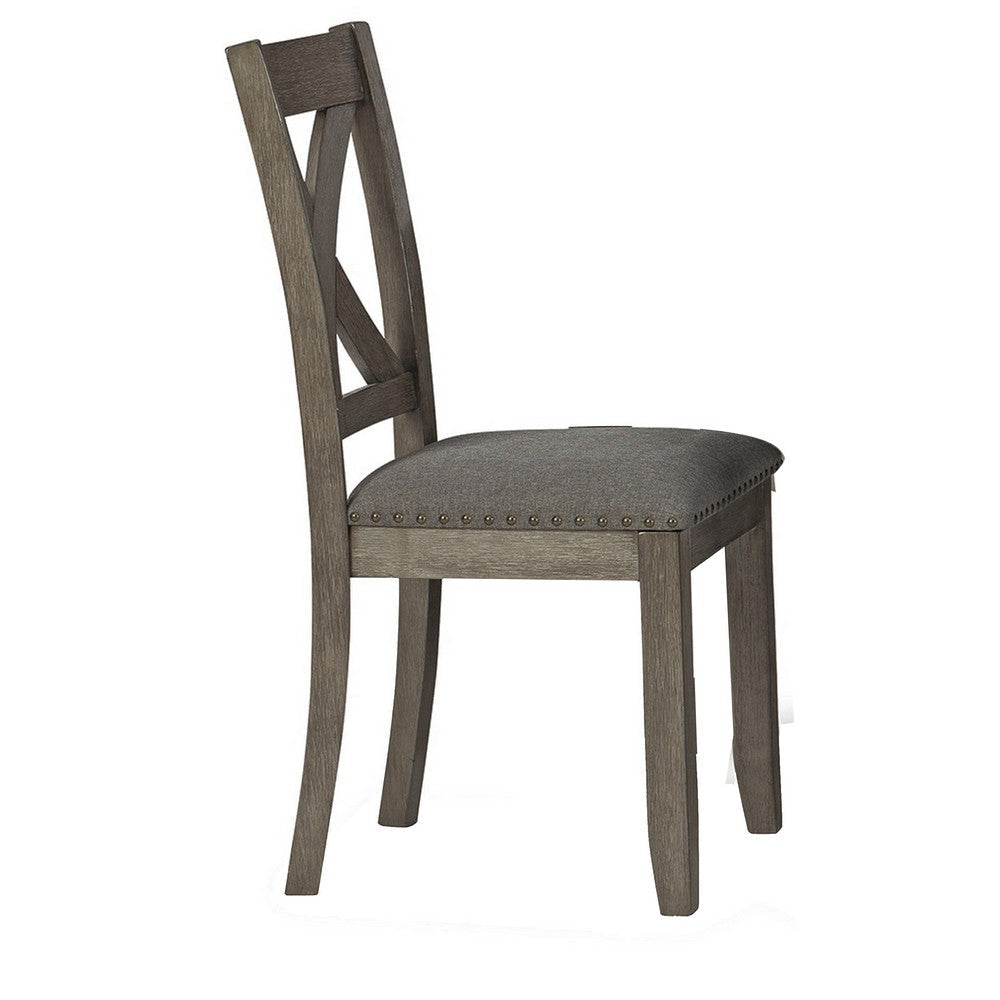 Close-up of a gray wood dining chair with a lattice back and upholstered seat
